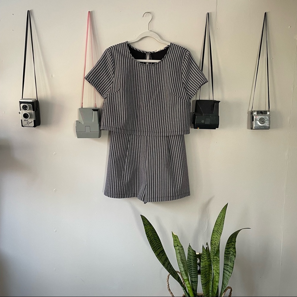 short-sleeved romper with open back detail!